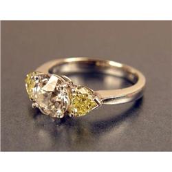 A PLATINUM, DIAMOND AND YELLOW SAPPHIRE RING
