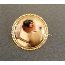 A YELLOW GOLD-FILLED HAND-PAINTED PORCELAIN JACK RUSSEL CIRCULAR PIN