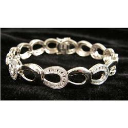 A 14K WHITE GOLD AND DIAMOND HORSESHOE LINK BRACELET