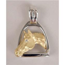 AN 18K YELLOW AND WHITE GOLD AND DIAMOND HORSE MOTIF PENDANT
