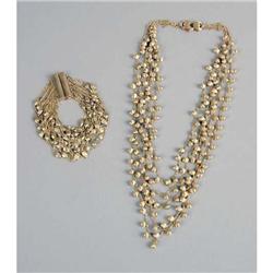 A MARIO BICEGO 18K YELLOW GOLD MULTI-STRAND NECKLACE AND BRACELET