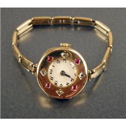 A 14K YELLOW GOLD, DIAMOND AND RUBY WATCH CASE