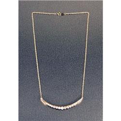 A 14K YELLOW GOLD AND DIAMOND CRESCENT-FORM BROOCH