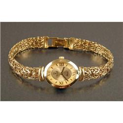 AN ITALIAN 14K YELLOW GOLD BRACELET WATCH