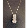 Image 1 : A 14K WHITE GOLD AND DIAMOND THREE STONE PENDANT