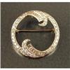 Image 1 : A PLATINUM AND DIAMOND CIRCLE BROOCH