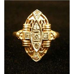 A 14K YELLOW GOLD AND DIAMOND RING