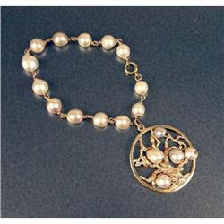 A 14K YELLOW GOLD AND GRAY PEARL BRACELET