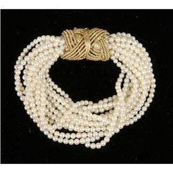 A FOURTEEN-STRAND PEARL TORSADE BRACELET WITH 18K YELLOW GOLD CLASP