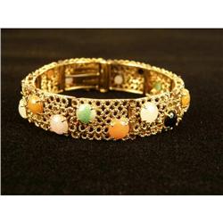 A 14K YELLOW GOLD AND MULTI-COLORED JADE BRACELET