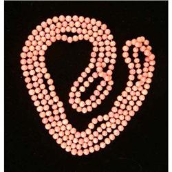 A CORAL BEAD ROPE NECKLACE