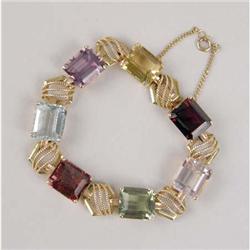 A 14K YELLOW GOLD AND SEMI-PRECIOUS STONE LINK BRACELET