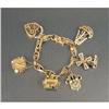 Image 1 : A 14K YELLOW GOLD CHARM BRACELET