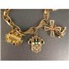 Image 2 : A 14K YELLOW GOLD CHARM BRACELET