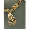 Image 4 : A 14K YELLOW GOLD CHARM BRACELET