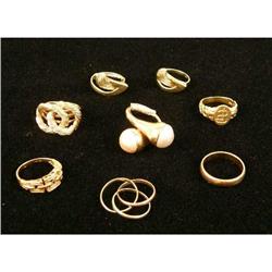 EIGHT YELLOW GOLD RINGS