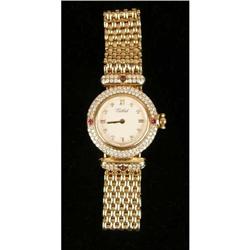 A TABBAH 18K YELLOW GOLD, DIAMOND AND RUBY BRACELET WRISTWATCH