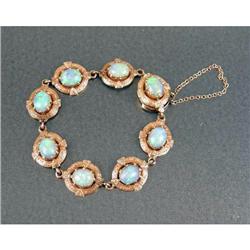 A 14K YELLOW GOLD AND OPAL LINK BRACELET