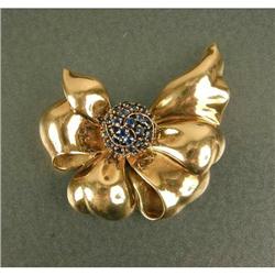 A CARTIER ROSE GOLD AND SAPPHIRE RETRO BOW-FORM BROOCH