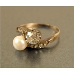 A SILVER-TOPPED GOLD, PEARL AND DIAMOND CROSSOVER RING