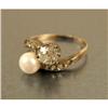 Image 1 : A SILVER-TOPPED GOLD, PEARL AND DIAMOND CROSSOVER RING