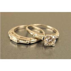 A 14K WHITE GOLD AND DIAMOND ENGAGEMENT RING AND DIAMOND BAND