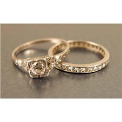 A PLATINUM AND DIAMOND ENGAGEMENT RING AND BAND