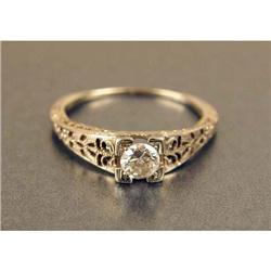 AN 18K WHITE GOLD AND DIAMOND RING