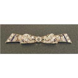 A PLATINUM, SAPPHIRE AND DIAMOND BOW BROOCH