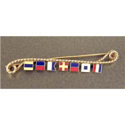 A 14K YELLOW GOLD AND ENAMEL NAUTICAL FLAG BROOCH