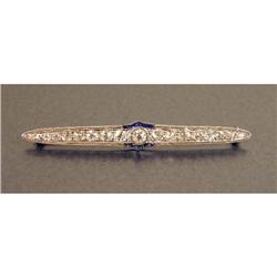 A PLATINUM, DIAMOND AND SAPPHIRE BAR BROOCH