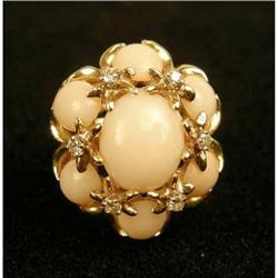 A 14K YELLOW GOLD, ANGELSKIN CORAL AND DIAMOND COCKTAIL DOME RING