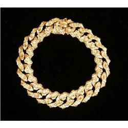 A 14K YELLOW GOLD AND BRUSHED GOLD LINK BRACELET