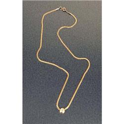 A 14K YELLOW GOLD AND DIAMOND NECKLACE
