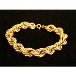 A 14K YELLOW GOLD ROPE-FORM BRACELET