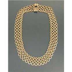 AN 18K YELLOW GOLD TRIPLE-CHAIN-FORM NECKLACE