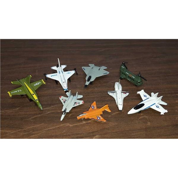 Lot with 7 fighter planes and one helicopter