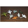 Lot with 7 fighter planes and one helicopter