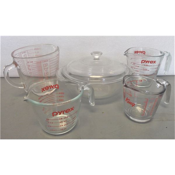 Four Pyrex Measuring Cups and a Casserole Dish
