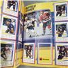 Image 6 : two NHL sticker books , partly filled