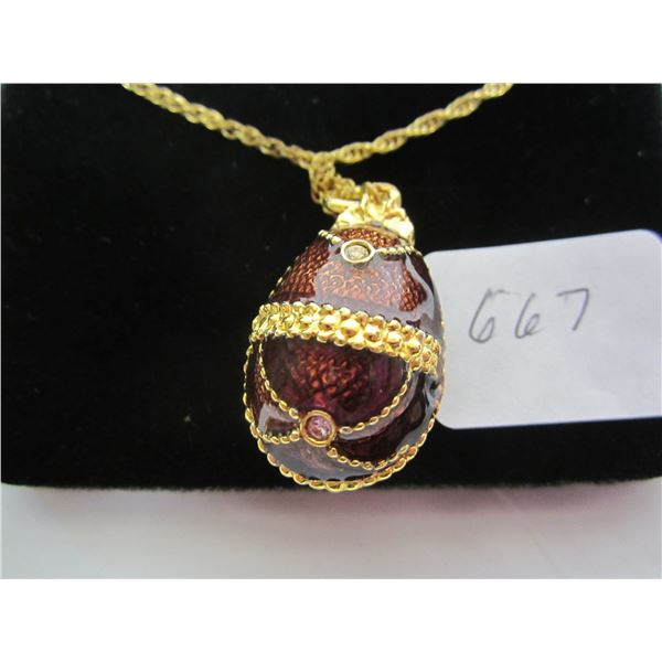 Egg Shaped Pendant on Gold Colored Chain