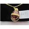 Image 1 : Egg Shaped Pendant on Gold Colored Chain