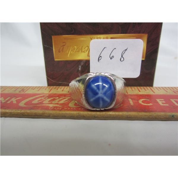 silver coloured ring w/ blue stone -stamped "seta" inside