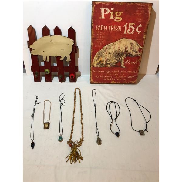 Assorted coat hanger, pictures and necklaces.