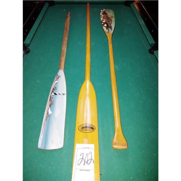 2 HAND PAINTED BOAT OARS, SIGNED BY ARTIST AND 1 FEATHER BRAND PADDLE