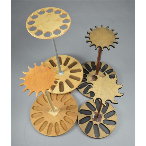 18 WOODEN REVOLVING GUN RACKS WITH METAL UPRIGHTS.