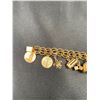 Image 2 : 14KT YELLOW GOLD CHARM BRACELET WITH 13 10KT AND 14KT YELLOW GOLD CHARMS, TOTAL WEIGHT 44.20G,