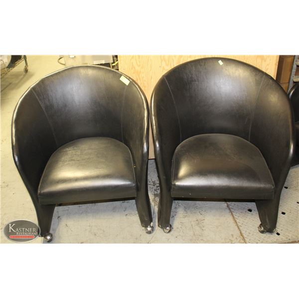 LOT OF TWO LEATHERETTE BUCKET CHAIRS ON CASTORS