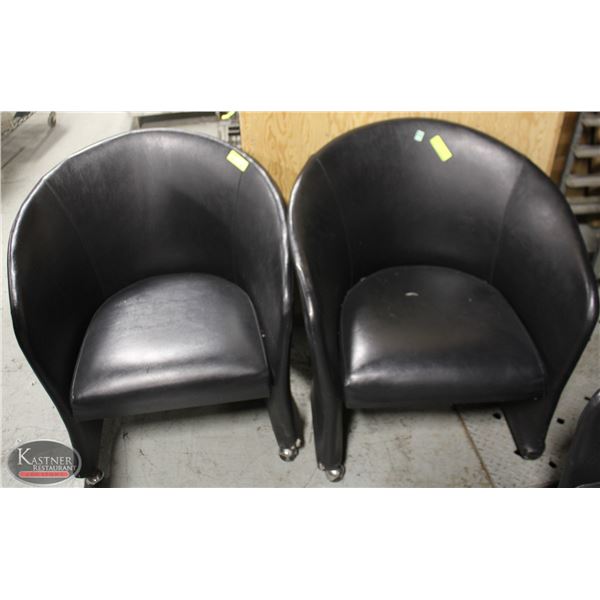 LOT OF TWO LEATHERETTE BUCKET CHAIRS ON CASTORS