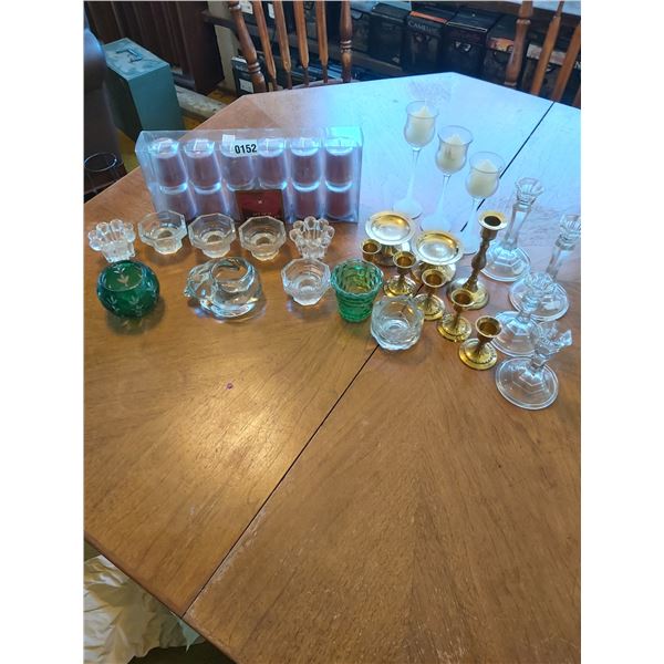 12 votive candles and asst candle holders